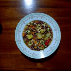 Githeri (Green maize- red bean salsa with vegetables) A picture of Githeri (Green maize- red bean salsa with vegetables).