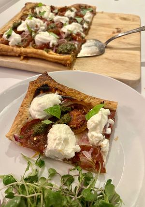 A picture of Roasted Tomato Tart with Ricotta and Pesto.
