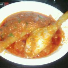 A picture of Tomatoes stew.