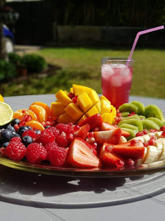 A picture of Summer Fruit Platter & Pomegranate Juice.