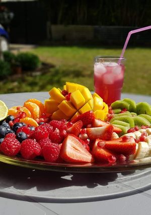 A picture of Summer Fruit Platter & Pomegranate Juice.