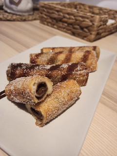 Una foto de Rollitos de Nutella y / o Lotus 😋
