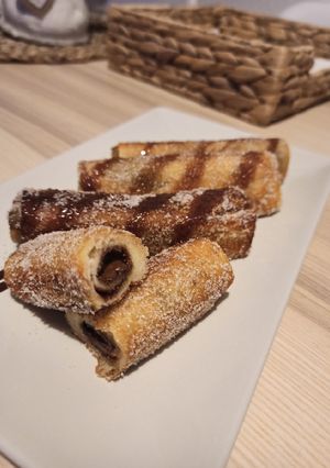 Una foto de Rollitos de Nutella y / o Lotus 😋