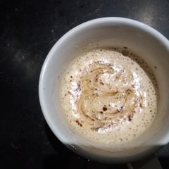 A picture of Hand beaten foamy coffee.