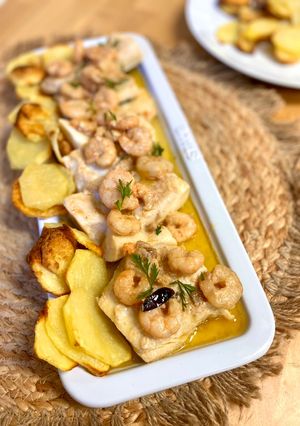 Una foto de Bacalao estilo bilbaína con gambas