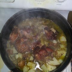 A picture of Italian green beans w/ onion potatoes & turkey tails.