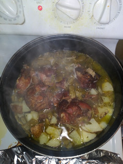 A picture of Italian green beans w/ onion potatoes & turkey tails.