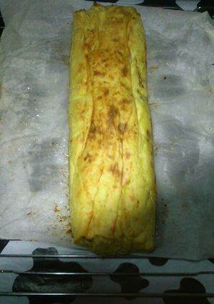 Una foto de Redondo de patata relleno