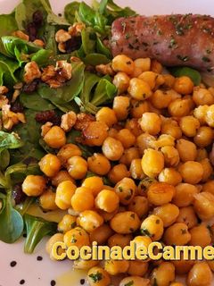 Una foto de Butifarra asada con garbanzos salteados
