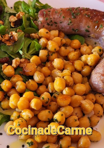 Una foto de Butifarra asada con garbanzos salteados