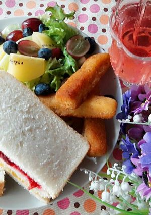 A picture of Healthy Breakfast ~ Homemade Two-Color Jam Sandwich + Fruit and Lettuce Salad + Crispy Cod Sticks + Cranberry Sparkling Water.