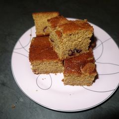 A picture of Cranberries and ginger sponge cakes.