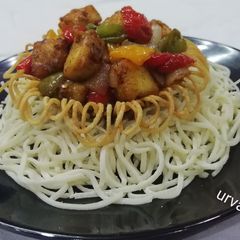 A picture of Paneer Chilli In Noodles Basket.