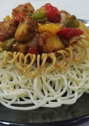 A picture of Paneer Chilli In Noodles Basket.