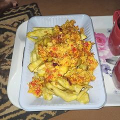 A picture of Fried sweet potatoes and egg sauce.
