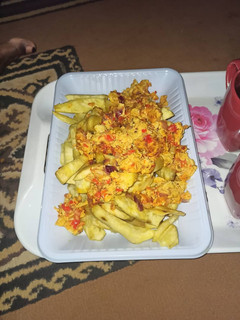 A picture of Fried sweet potatoes and egg sauce.