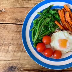 A picture of Spinach saute - one more green on a plate.