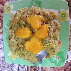 Moong dal khichdi with onion tomato and capsicum tadka A picture of Moong dal khichdi with onion tomato and capsicum tadka.
