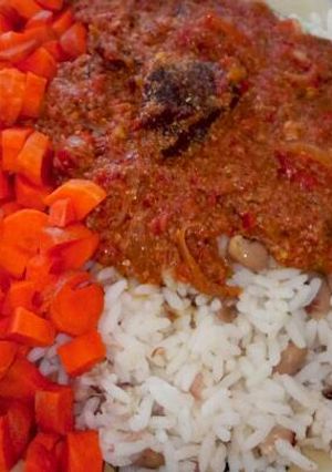 A picture of Pepper stew with rice and beans.