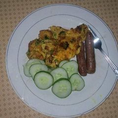 Fried sausages,eggs and cucumber A picture of Fried sausages,eggs and cucumber.