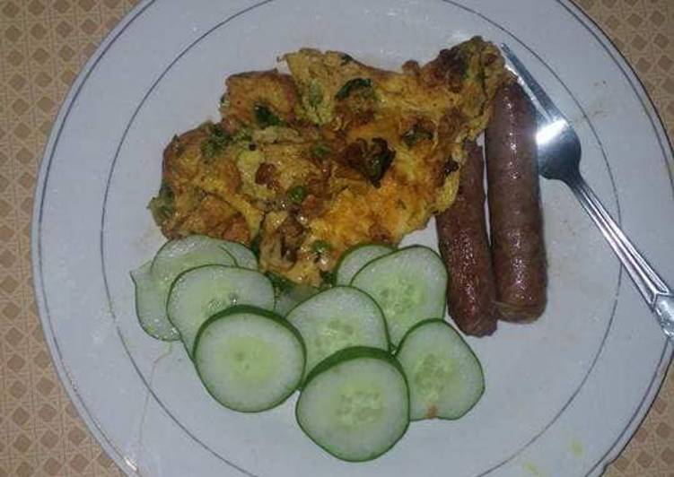 Fried sausages,eggs and cucumber
