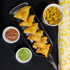 A picture of Crispy Chana dal maida samosa (jain snack).