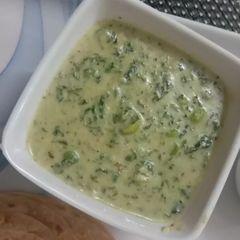 A picture of Methi Matar Malai in White Gravy.