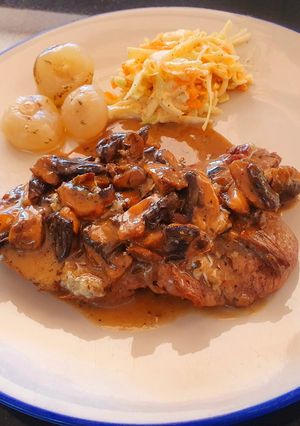 A picture of Beef fillet in creamy mushroom and gorgonzola sauce.