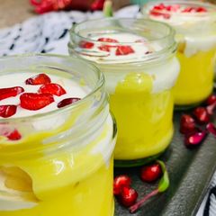 A picture of Custard fruit trifle in cups.
