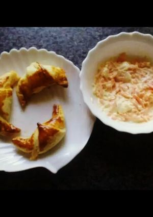 A picture of Cheesy mini croissants with coleslow salad.