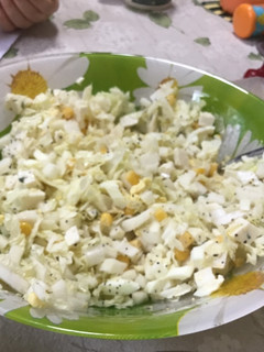 A picture of Salad with corn.