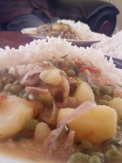 A picture of Peas mixed with meat and potatoes.