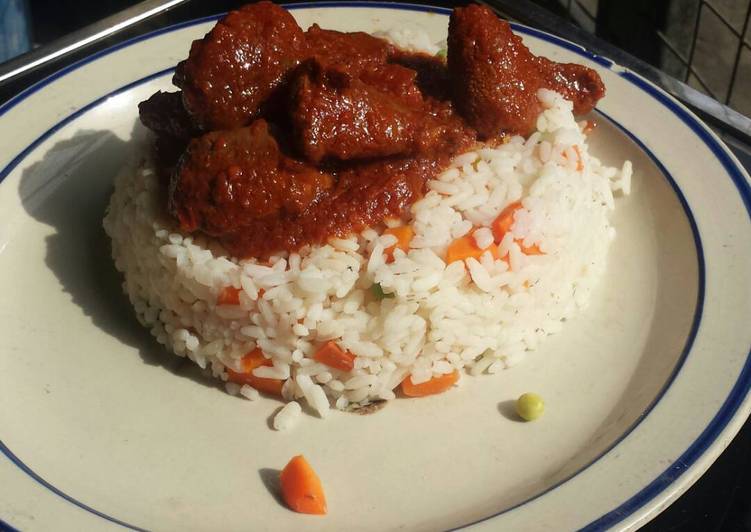 Veggie rice served with offals stew