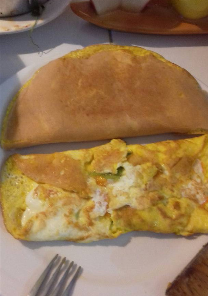 Una foto de Omelette de flor de calabaza en salsa verde. 😊