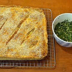 A picture of Potato slab pie with salsa verde.
