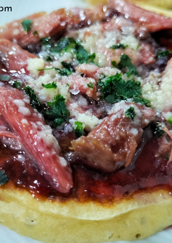 Una foto de Tortitas de pato, parmesano y arándanos