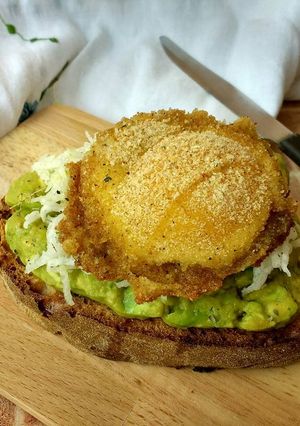 A picture of Bruschetta with Avocado, Daikon Noodle Salad, and Breaded Egg.