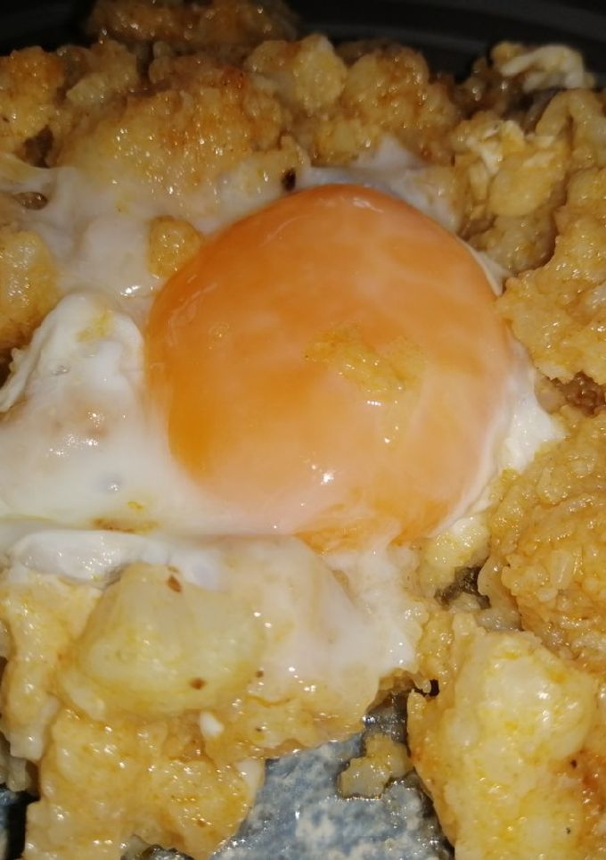 Una foto de Coliflor esparragada con huevo cuajado