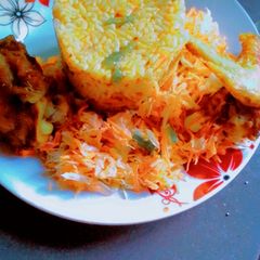 A picture of Nigeria party Jollof rice with salad.