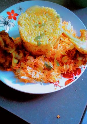 A picture of Nigeria party Jollof rice with salad.