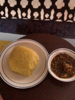 A picture of Vegetable soup with goat meat and Eba(Garri).