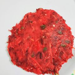 A picture of Beetroot and Carrot Uttapam.