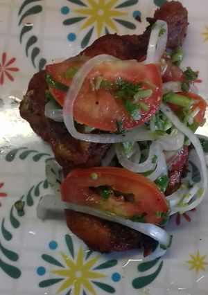 Una foto de Pollo pibíl asado