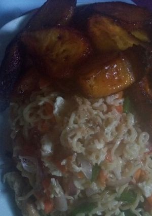 A picture of Indomie with egg sauce and plantain.