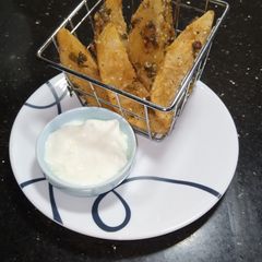 A picture of Potato Masala Wedges.