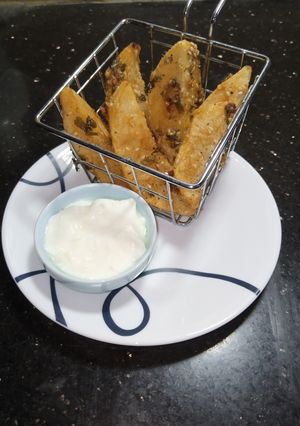 A picture of Potato Masala Wedges.