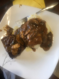 A picture of Beef tenderloin in mushroom sauce.