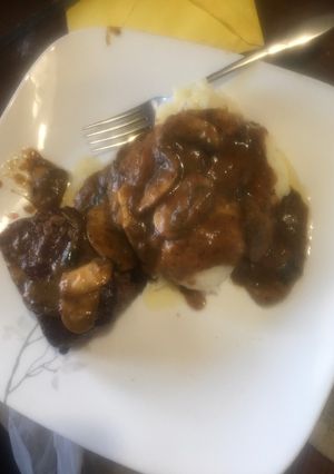 A picture of Beef tenderloin in mushroom sauce.