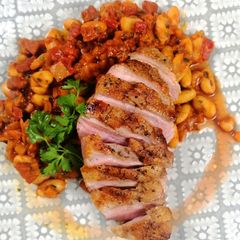 A picture of Duck breast with chorizo cassoulet.