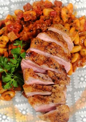 A picture of Duck breast with chorizo cassoulet.